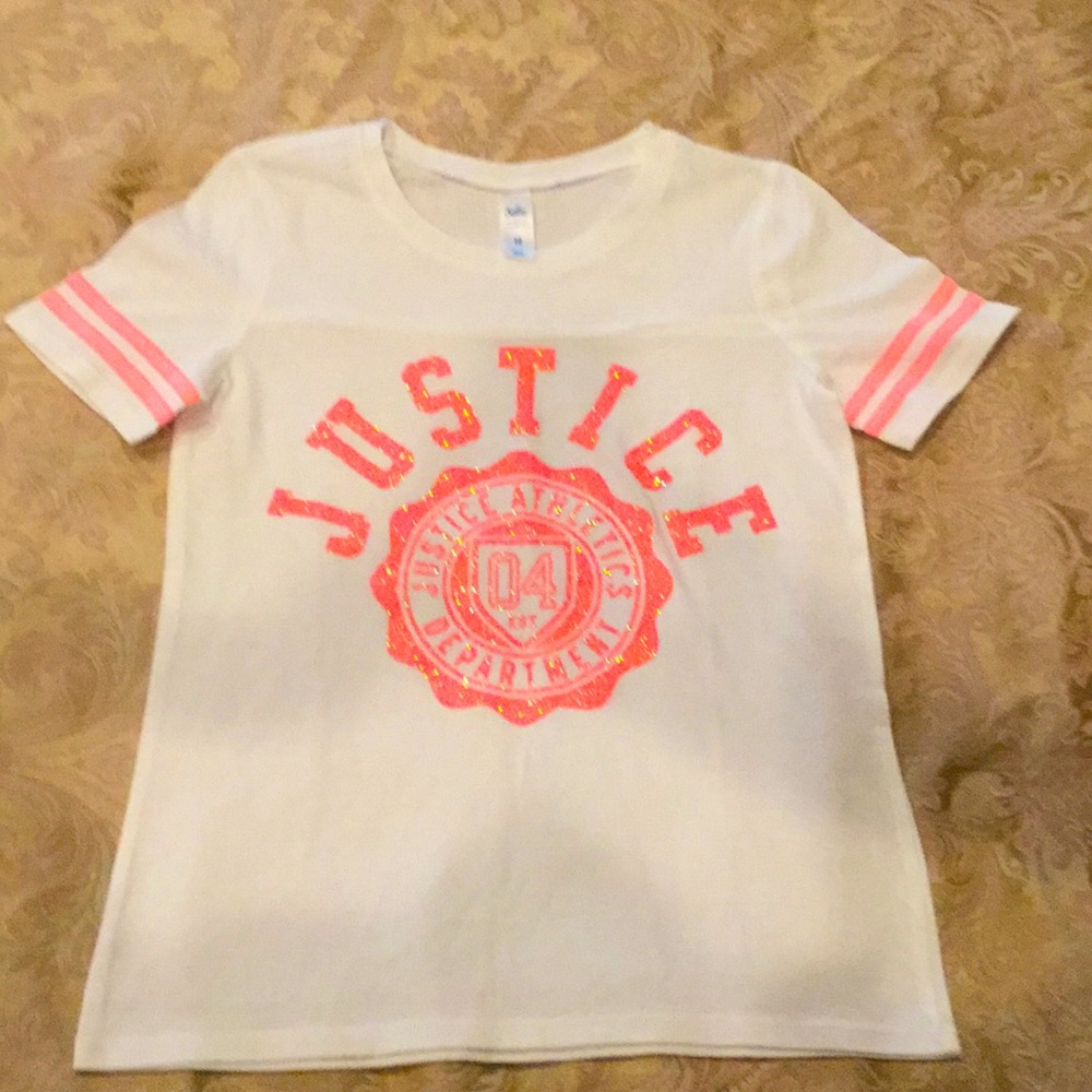 Justice white shirt with a coral sparkly logo